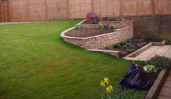 After - retaining walling and planted area